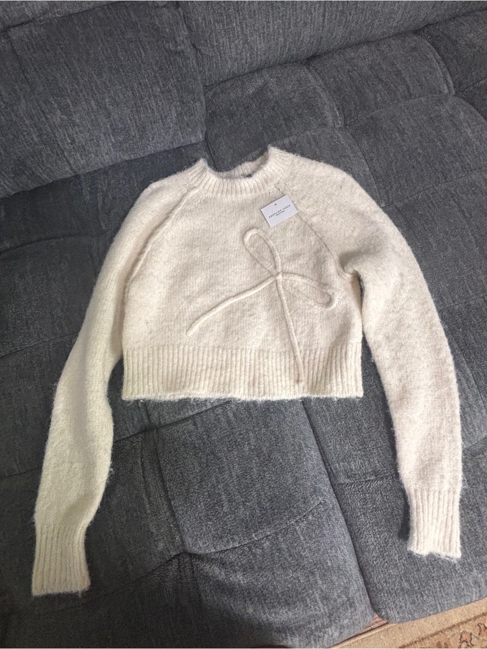 American Eagle Outfitters Cream Cropped Crewneck Sweater with Bow Detail
